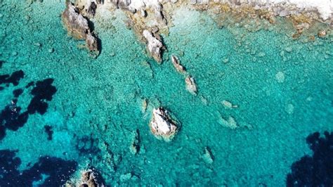 Aerial View Of Small Rock Formation In Clear Sea Water At Agia Eleni