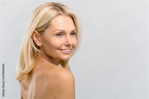 Close Up Portrait Of Naked Middle Aged Lady Looking Aside And Smiling