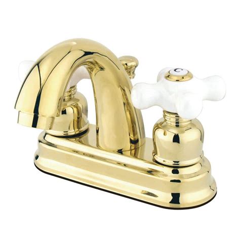 Kingston Brass Restoration 4 In Centerset 2 Handle Bathroom Faucet With Plastic Pop Up In