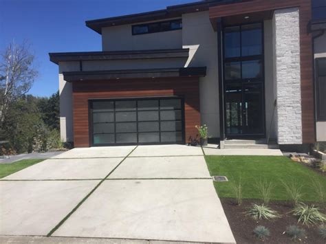 Concrete Driveway With Grass Strips In Abbotsford Bc In 2020 Concrete Driveways Smooth