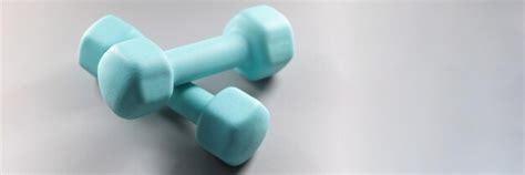 Premium Photo Pair Of Blue Dumbbells On Grey Surface Planning Weight