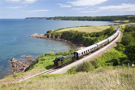 Dartmouth Steam Railway Train Steaming Along The Devon Coast Near