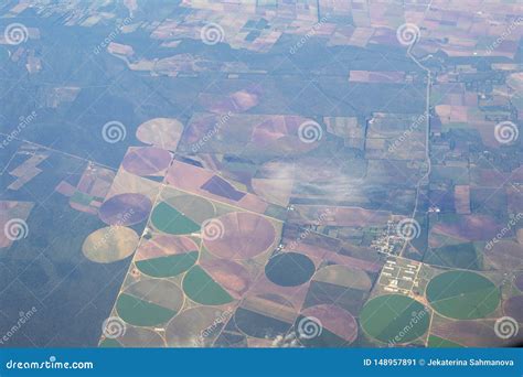 Aerial View Of American Countryside Farmland From The Plane With Green