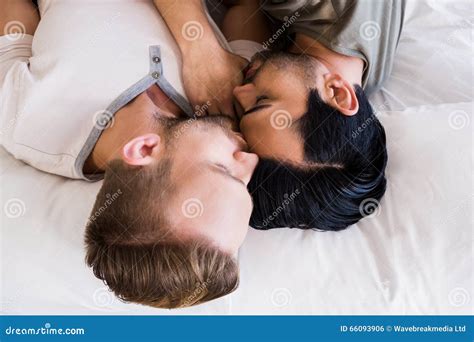 Happy Gay Couple Lying On Bed Stock Photo Image Of Duvet Male