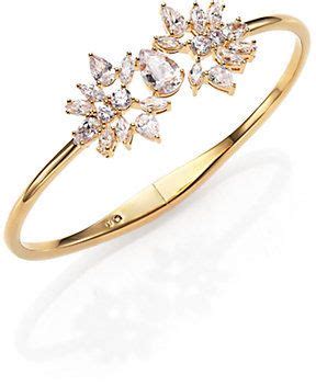 A Gold Ring With Three Diamonds On It