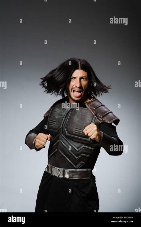 Angry Warrior Against Dark Background Stock Photo Alamy