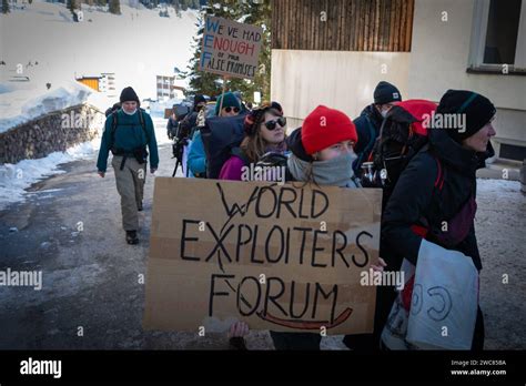 Davos Switzerland 14th Jan 2024 A Protester Holds A Placard During