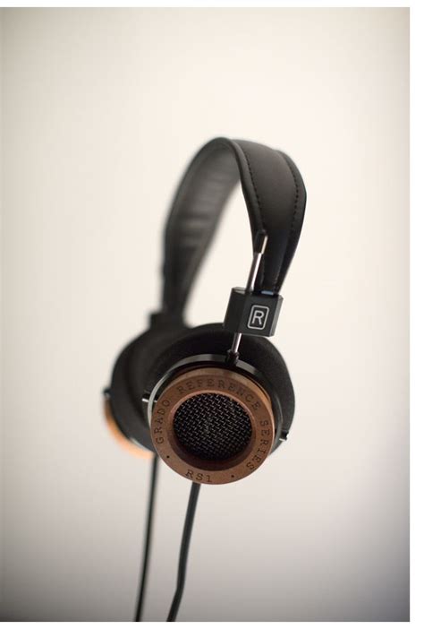 A Pair Of Headphones That Are Sitting On Top Of Each Other In Front Of