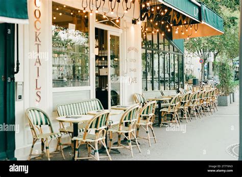 Paris cafe with green awning and beautiful lights Stock Photo - Alamy