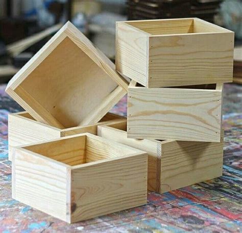 Four Wooden Boxes Stacked On Top Of Each Other