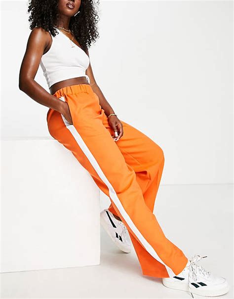 Asos Design Elastic Waist Tailored Pants In Amber With Ivory Side