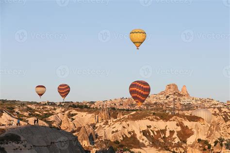 Hot Air Balloons Over Goreme Town Stock Photo At Vecteezy