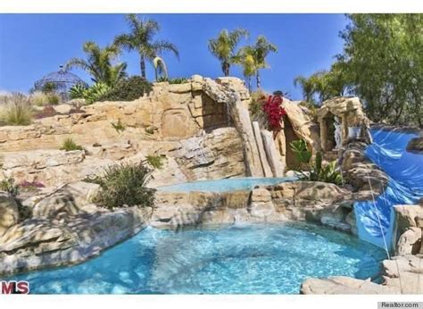 6 Epic Water Slides That Make A Lavish Swimming Pool Even Better ...