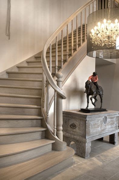 The Stairs In This House Are Made From Wood And Have Been Painted White