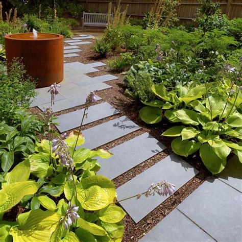 Strolling Through A Modern Garden Path Where Nature And Design