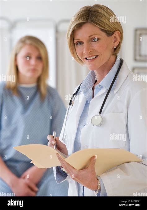 Female Doctor Holding Chart Stock Photo Alamy