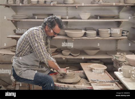 Male Potter Molding A Clay In Pottery Workshop Stock Photo Alamy