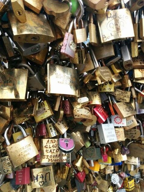 Many Padlocks Are Attached To The Wall