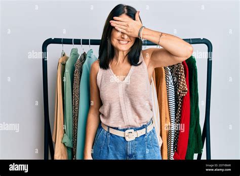 Middle Age Brunette Woman Working As Professional Personal Shopper