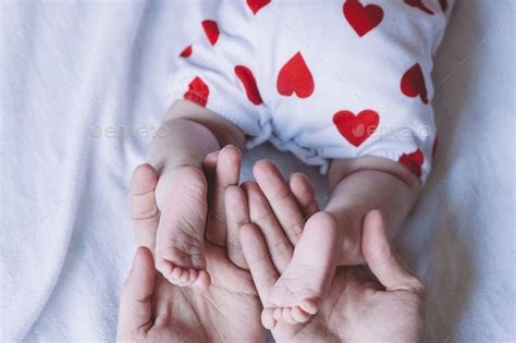 Baby Legs In Fathers Hands Top View Stock Photo By Oliamagnolia