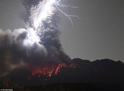 Clash of nature's titans: Astonishing moment volcanic ash cloud is ...