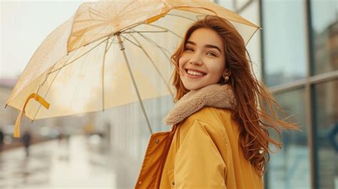 Premium Photo Cheerful Pretty Girl Holding Umbrella While Strolling