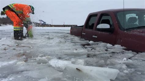 Crew Saws Chisels Pulls Out Truck Stuck In Regina Beach Ice