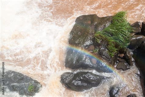 Rainbow at Iguacu (Iguazu) falls on a border of Brazil and Argentina ...