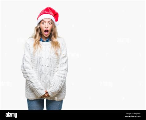 Beautiful Young Blonde Woman Wearing Christmas Hat Over Isolated