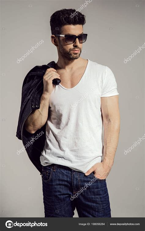 Handsome Man Holding Jacket His Hand Wearing Sunglasses Stock Photo