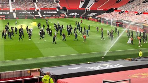 Man Utd Match Postponed After Fans Get On The Old Trafford Pitch During