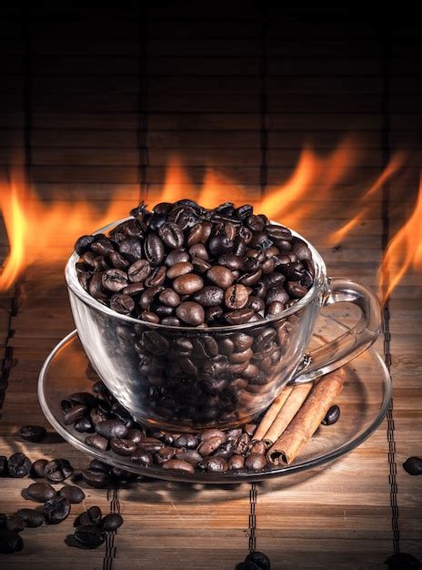 Premium Photo | Steaming cup of coffee on fire