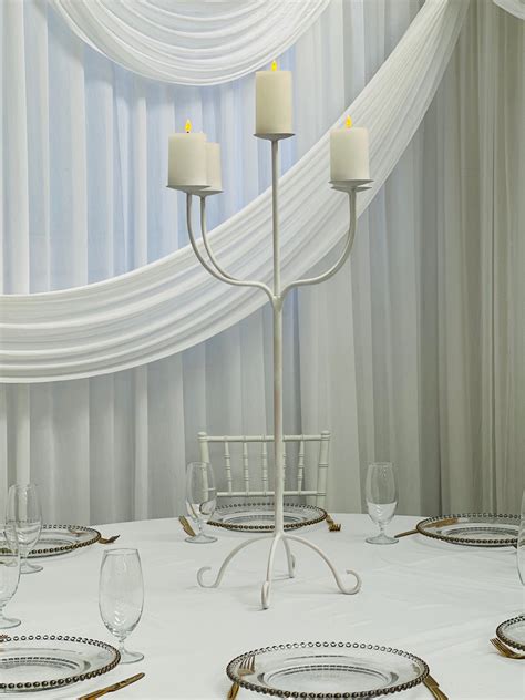 White 5 Prong Traditional Candelabra With LED Pillar Candles On Mirror