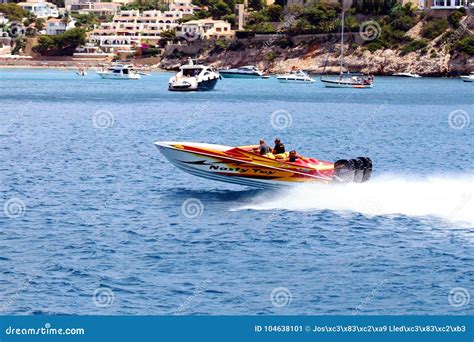 Three Engines Power Boat Sailing Fast Close To Alicante Coast In Spain