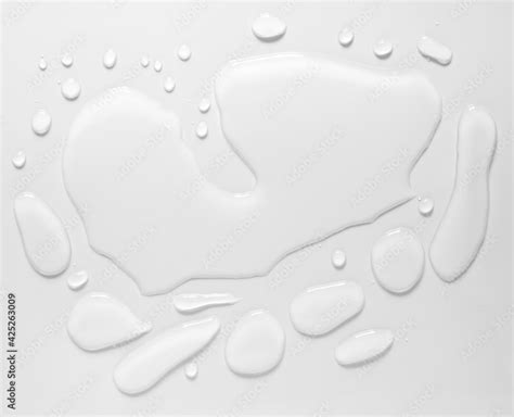 Real Image Top View Spilled Water Drop On The Floor Isolated On White