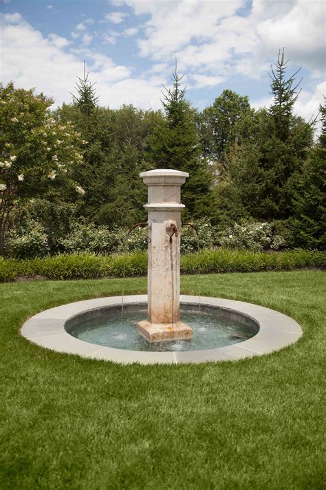 This French Country Fountain Serves As A Focal Point In A Transitional