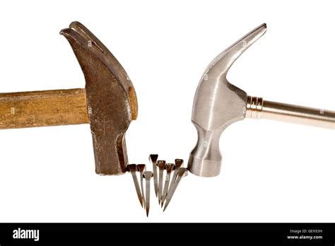 Hammers and nails isolated on white Stock Photo - Alamy