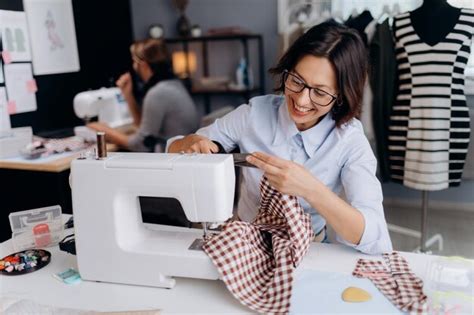 Premium Photo Smiling Woman Using Sewing Machine