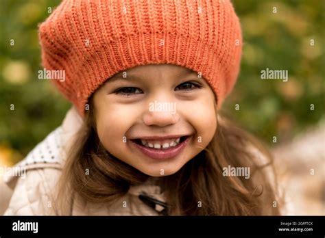 Close Up Portrait Of Little Cute Preschool Minor Girl In Orange Beret