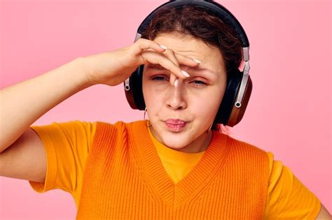 Premium Photo Cheerful Woman Listening To Music With Headphones