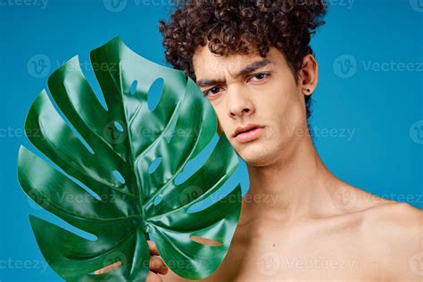 Man With Curly Hair Naked Shoulders Green Leaves Ecology 21986732 Stock