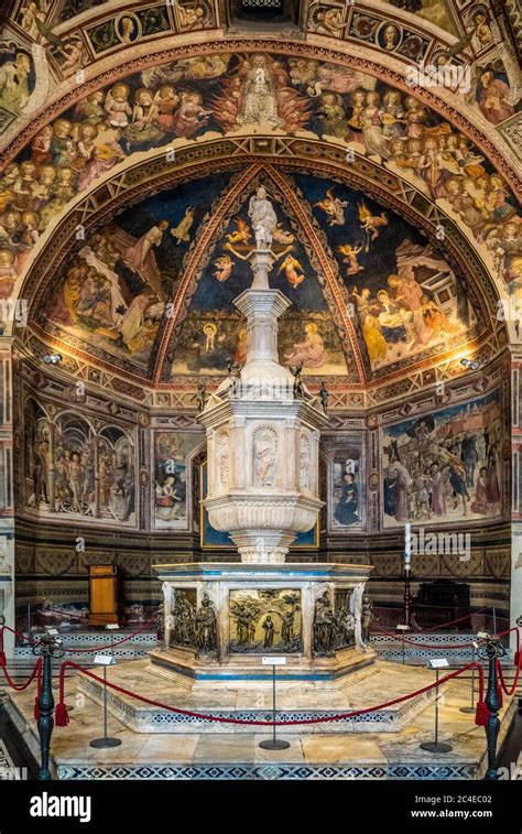 Baptistery ceiling frescoes and baptismal font. Siena Cathedral. Italy ...