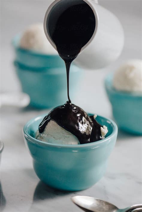 Pouring Chocolate Sauce On A Sundae By Stocksy Contributor CWP LLC