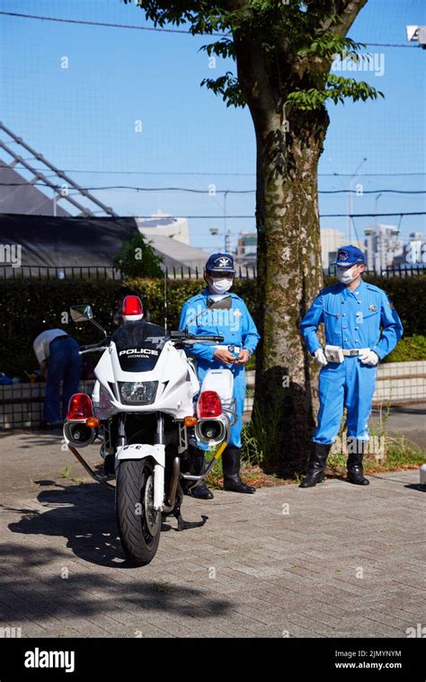 Japanese Police Men Standing Next To Police Motorcycle Japan Stock