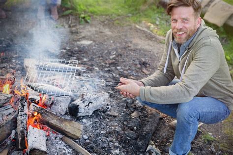 Cooking Fish Over Campfire