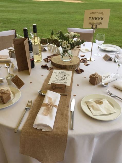 A Table Set Up With Place Settings And Napkins For Guests To Enjoy The Meal