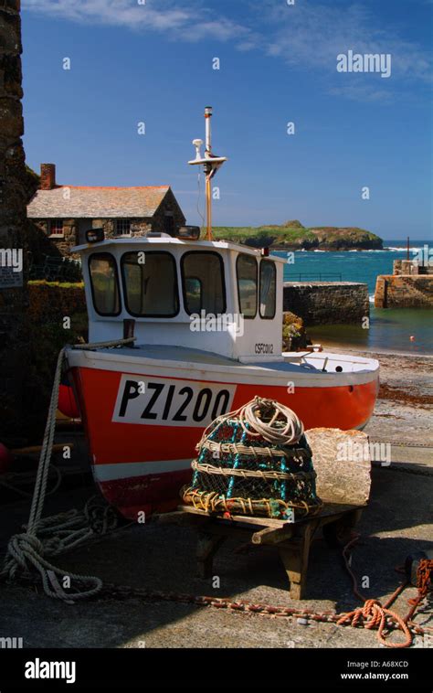 Fishing Boat Moored On The Slipway At Mullion Cove Cornwall UK Stock