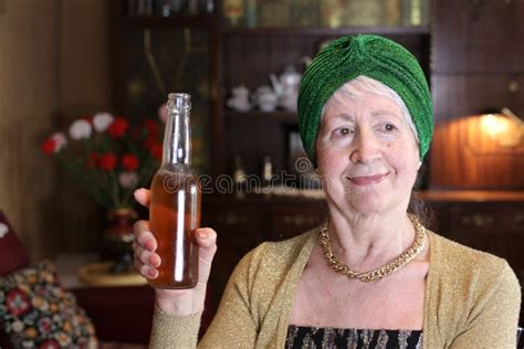 Senior Woman Drinking Beer at Home Stock Photo - Image of drinking ...