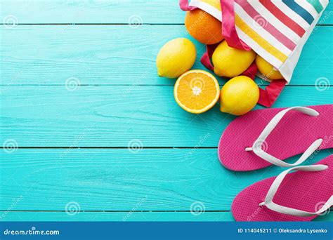 Summer Fun Time and Fruits on Blue Wooden Background. Mock Up Orange, Lemon Fruit in Bag and ...