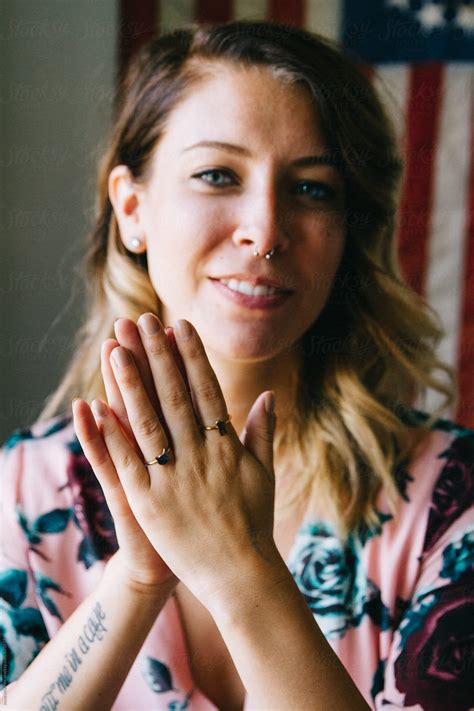 Portrait Of Young Female Laughing In Front Of American Flag Del